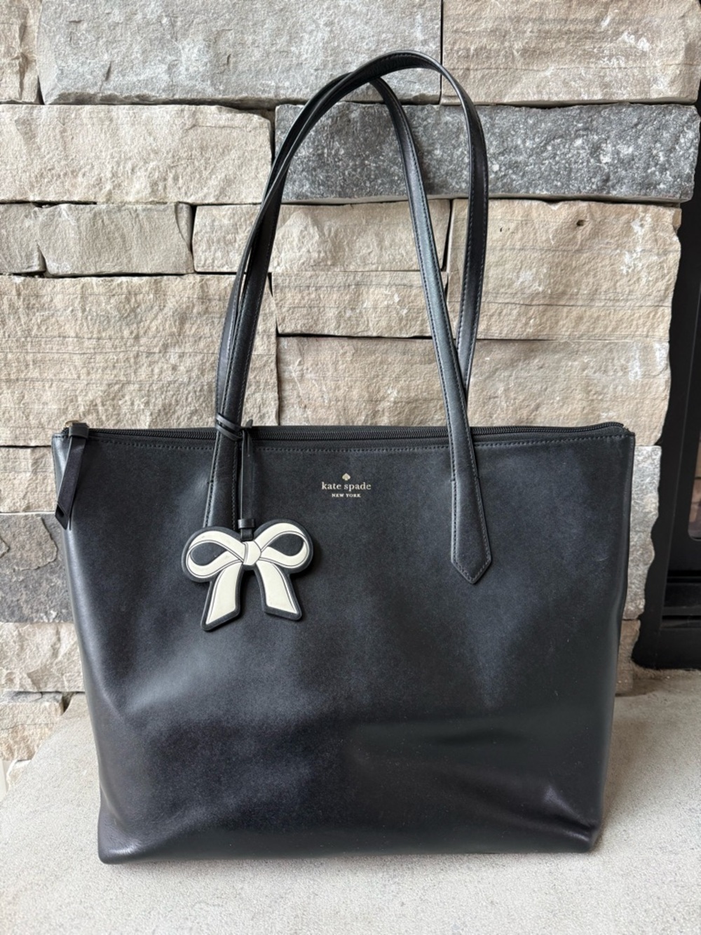 kate spade black leather tote with white bow charm